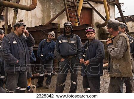 Stock Image - Romania, Group of miners; Petrosa. Fotosearch