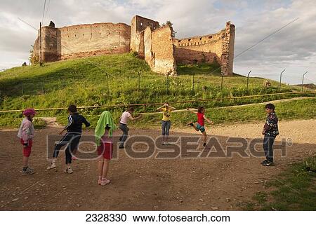 Romania, Kids playing near old ruin; Slimnic View Large Photo Image Stock Image - Romania, Kids playing near old ruin; Slimnic. Fotosearch