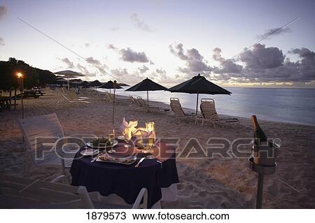 Stock Image - Romantic Candlelit Meal On The Beach. Fotosearch