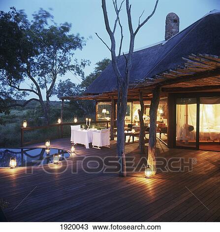 Stock Image - Romantic Patio With Lanterns. Fotosearch
