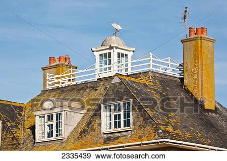 Stock Photo - Roof And Weather Vane; West Bay, Jurassic Coast, Dorset, England. Fotosearch