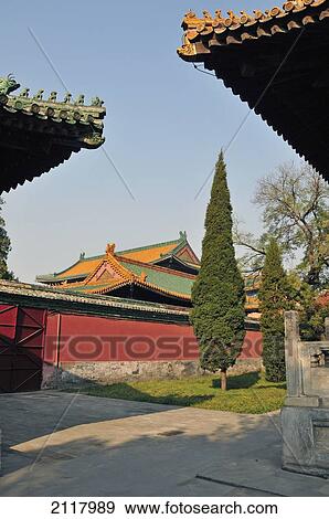 Rooflines Of Buildings Against A Blue Sky In Beihai Park; Beijing China View Large Photo Image Stock Photo - Rooflines Of Buildings Against A Blue Sky In Beihai Park; Beijing China. Fotosearch