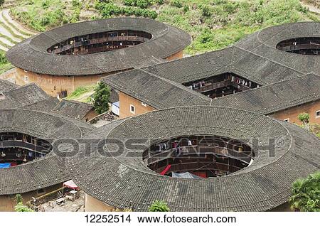 Picture - Roofs of Tulou buildings in a village from Hakka minority group were built eight centuries ago; Yongding, Fujian province, China. Fotosearch