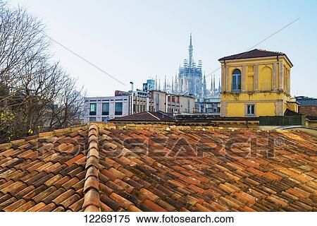 Rooftop and Milan Cathedral in the distance; Milan, Lombardy, Italy View Large Photo Image Stock Photography - Rooftop and Milan Cathedral in the distance; Milan, Lombardy, Italy. Fotosearch