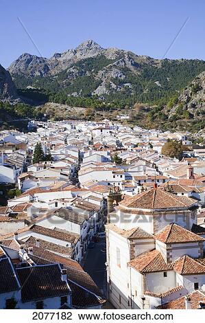 Rooftops Of White Buildings And A Mountain In The Distance Against A Blue Sky; Grazalema Andalusia Spain View Large Photo Image Stock Image - Rooftops Of White Buildings And A Mountain In The Distance Against A Blue Sky; Grazalema Andalusia Spain. Fotosearch