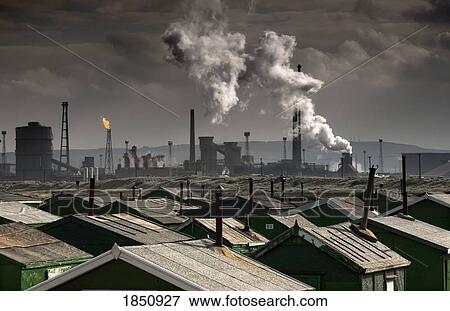 Stock Photo - Rooftops With A Factory In Background; Teesside, North East England. Fotosearch