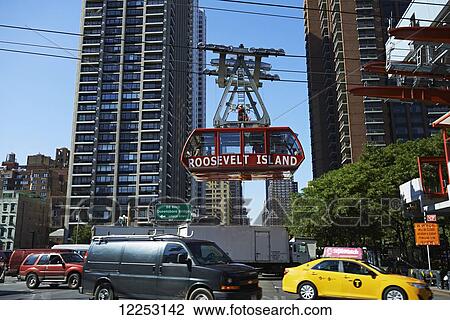 Stock Image - Roosevelt Island tram leaving Manhattan; New York City, New York, United States of America. Fotosearch