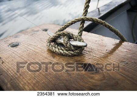 Stock Image - Rope Tied To A Skiff In Kachemak Bay, Kenai Peninsula; Alaska, United States Of America. Fotosearch