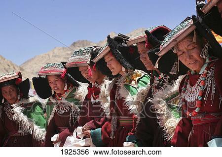 Stock Photograph - Row Ao Women In Traditional Dress Praying At Shey Monastery, Nubra Valley, Leh Ladakh, India, 800 Year Old Birthday Celebration, Rituals Of Buddhist Drukpa Lineage. Fotosearch