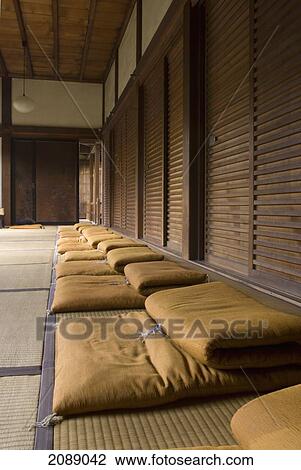 Stock Image - Row Of Meditation Cushions In A Japanese Temple; Kyoto, Japan. Fotosearch