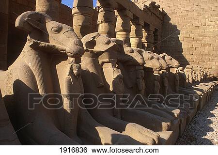 Stock Photograph - Row Of Ram Headed Sphinxes At Great Temple Of Amun. Fotosearch