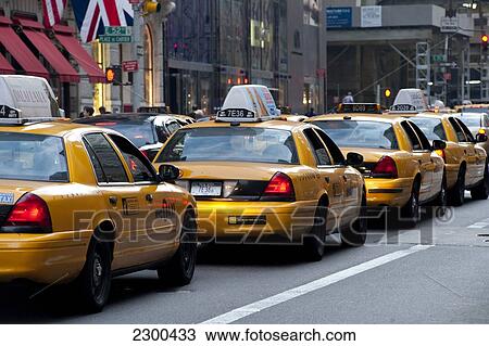 Row Of Taxis In 5Th Avenue, Midtown Manhattan, New York, Usa View Large Photo Image Stock Image - Row Of Taxis In 5Th Avenue, Midtown Manhattan, New York, Usa. Fotosearch