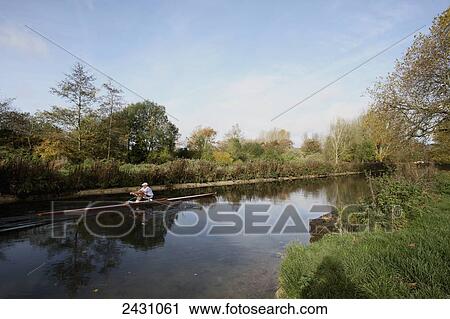 Stock Image - Rowing on the Itchen Navigation Canal; Winchester, Hampshire, England. Fotosearch