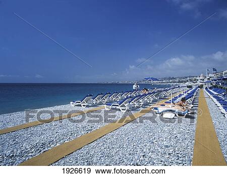 Stock Photo - Rows Of Sunloungers On Beach; Nice, Cote D'azur, France. Fotosearch