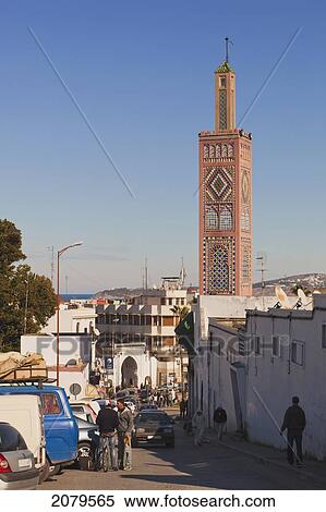 Rue Sidi Bouabid Leading Into Le Grand Socco With The Minaret Of The Sidi Bou Abib Mosque; Tangiers Morocco View Large Photo Image Stock Photography - Rue Sidi Bouabid Leading Into Le Grand Socco With The Minaret Of The Sidi Bou Abib Mosque; Tangiers Morocco. Fotosearch