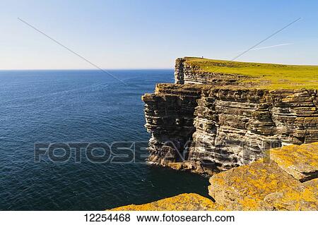 Rugged cliffs along the coast of Orkney Islands; Orkney, Scotland View Large Photo Image Stock Photo - Rugged cliffs along the coast of Orkney Islands; Orkney, Scotland. Fotosearch