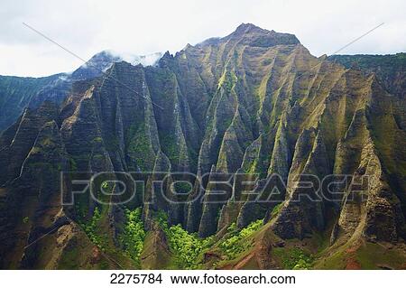 Rugged landscape on an hawaiian island; Na Pali coast of Kauai, Hawaii, United States of America View Large Photo Image Picture - Rugged landscape on an hawaiian island; Na Pali coast of Kauai, Hawaii, United States of America. Fotosearch