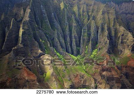 Stock Image - Rugged landscape on an hawaiian island; Na Pali coast of Kauai, Hawaii, United States of America. Fotosearch