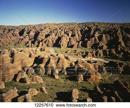 Stock Image - Rugged landscape with eroded rock formations. Fotosearch