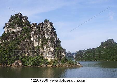Rugged rock cliffs; Ha Long Bay, Vietnam View Large Photo Image Stock Photograph - Rugged rock cliffs; Ha Long Bay, Vietnam. Fotosearch