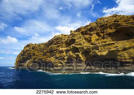 Stock Image - Rugged rock on the coastline of an hawaiian island; Hawaii, United States of America. Fotosearch