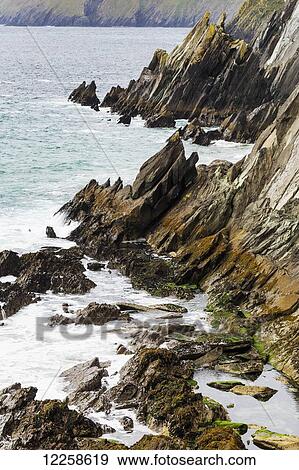 Rugged rocky shoreline; Dingle, County Kerry, Ireland View Large Photo Image Stock Photo - Rugged rocky shoreline; Dingle, County Kerry, Ireland. Fotosearch