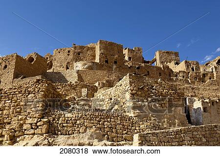 Ruins Of A Berber Village In The Tataouine Province; Chenini, Tunisia, North Africa View Large Photo Image Stock Photo - Ruins Of A Berber Village In The Tataouine Province; Chenini, Tunisia, North Africa. Fotosearch