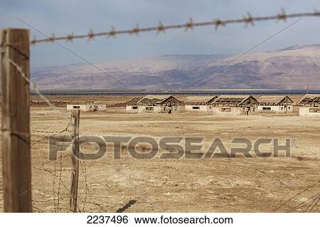 Ruins Of A Jewish Settlement Along The Dead Sea As Seen Through A Barbed Wire Fence; Israel View Large Photo Image Stock Photograph - Ruins Of A Jewish Settlement Along The Dead Sea As Seen Through A Barbed Wire Fence; Israel. Fotosearch