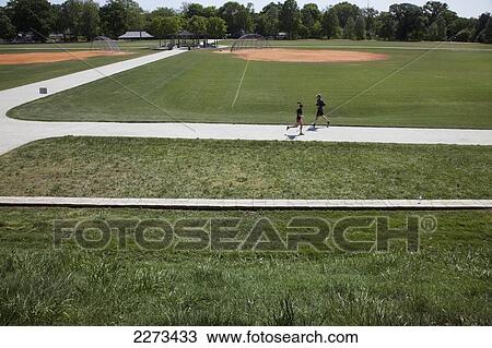 Stock Image - Runners on track; atlanta georgia usa. Fotosearch