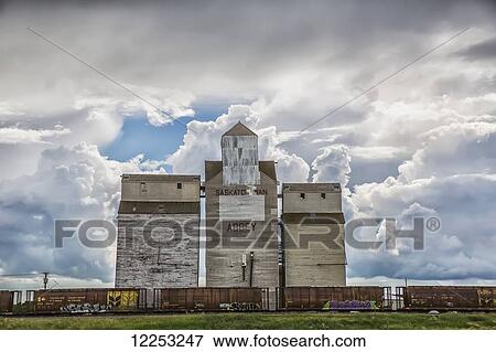 Rural grain elevator with cumulonimbus clouds building up around it; Saskatchewan, Canada View Large Photo Image Stock Photo - Rural grain elevator with cumulonimbus clouds building up around it; Saskatchewan, Canada. Fotosearch