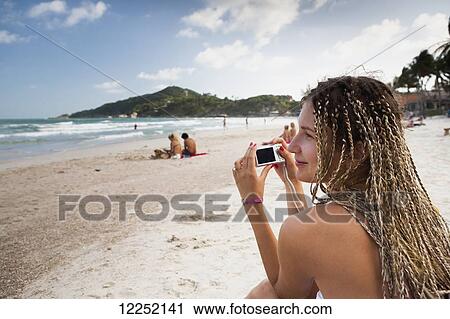 Stock Image - Russian girl poses on Haad Rin beach; Ko Phangan, Thailand. Fotosearch