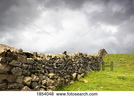 Stock Photo - Rustic Stone Fence; Northumberland, England. Fotosearch