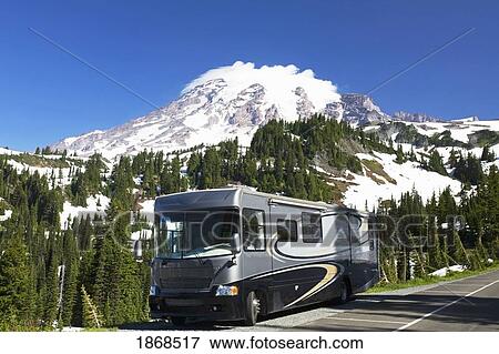 Stock Photo - Rv Parked On The Side Of The Road With Mountain In The Background. Fotosearch