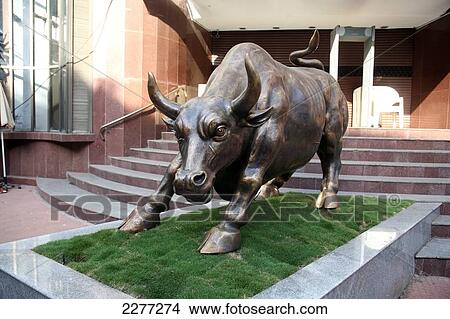 Picture - Sacred bull at the entrance to the Bombay Stock Exchange in the heart of the commercial Fort area; Mumbai, Maharashtra State, India. Fotosearch