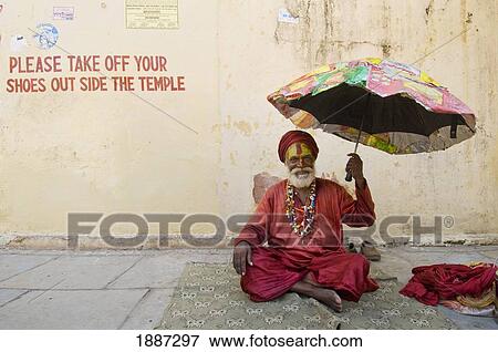 Sadhu With Umbrella Outside Small Temple View Large Photo Image Stock Photo - Sadhu With Umbrella Outside Small Temple. Fotosearch