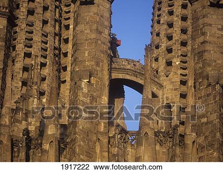 Stock Image - Sagrada Familia Detail Of Tourist Walking Between Spires At Dusk In Barcelona, Spain. Fotosearch
