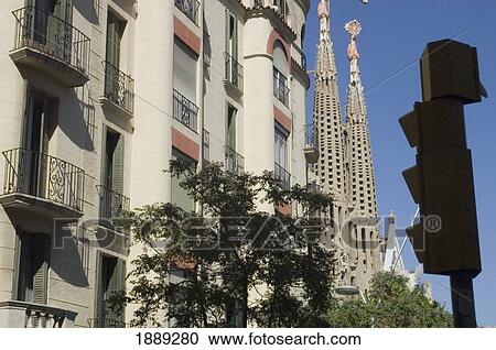 Stock Image - Sagrada Familia, Nearby Buildings And Traffic Light. Fotosearch