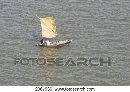 Stock Photograph - Sail Boat On The Ganges River, Patna, Bihar, India. Fotosearch