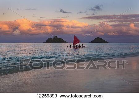 Stock Photo - Sailboat at sunset; Kailua, Hawaii, United States of America. Fotosearch