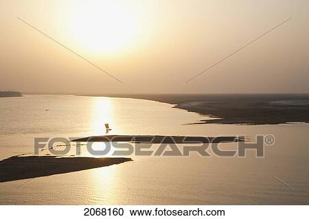 Sailboat On The Ganges River At Sunset, Patna, Bihar, India View Large Photo Image Stock Image - Sailboat On The Ganges River At Sunset, Patna, Bihar, India. Fotosearch