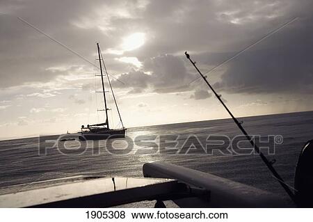 Stock Photo - Sailboats At Dusk In Queensland, Australia. Fotosearch