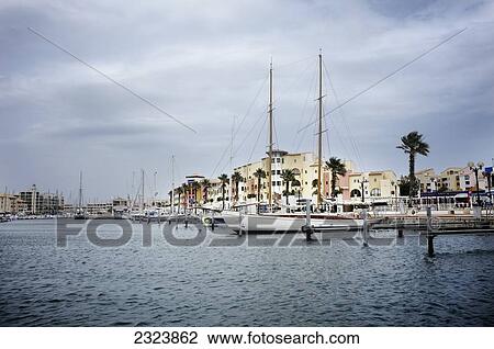 Sailboats docked in the Mediterranean harbor of Cap Leucate; France View Large Photo Image Stock Image - Sailboats docked in the Mediterranean harbor of Cap Leucate; France. Fotosearch
