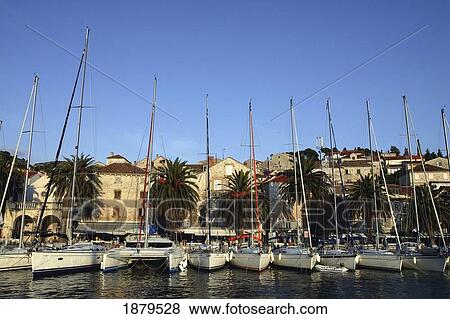 Stock Photo - Sailboats Lined Up In Hvar Harbour. Fotosearch
