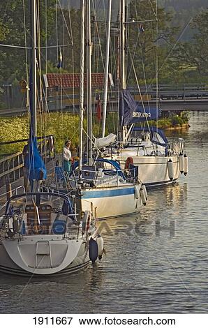 Sailboats Moored Along Gota Canal, Sweden View Large Photo Image Stock Photo - Sailboats Moored Along Gota Canal, Sweden. Fotosearch