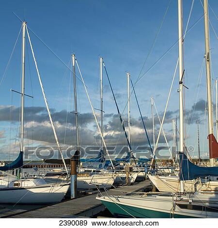 Stock Photo - Sailboats mooring along a dock in Hecla-Grindstone Provincial Park; Riverton, Manitoba, Canada. Fotosearch