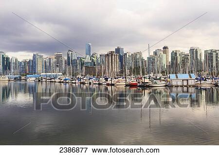 Stock Photo - Sailboats reflected in Coal Harbour; Vancouver, British Columbia, Canada. Fotosearch