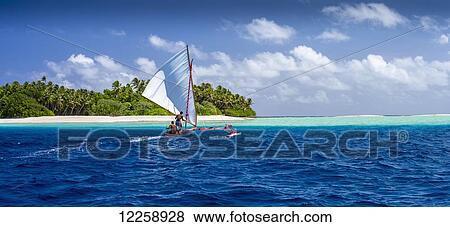 Stock Photo - Sailing a traditional boat among the Marshall Islands; Marshall Islands. Fotosearch