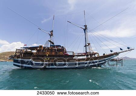 Sailing ship, Labuan Bajo, Flores, East Nusa Tenggara, Indonesia View Large Photo Image Stock Image - Sailing ship, Labuan Bajo, Flores, East Nusa Tenggara, Indonesia. Fotosearch