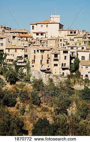 Stock Image - Saint Paul De Vence, Provence, France; Houses And Trees On A Hill. Fotosearch