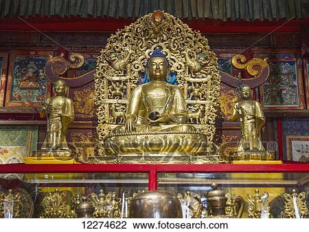 Stock Image - Sakyamuni, the Buddha of the Present, statue on display at the Main Temple of the Choijin Lama Temple Museum, Ulaanbaatar (Ulan Bator), Mongolia. Fotosearch